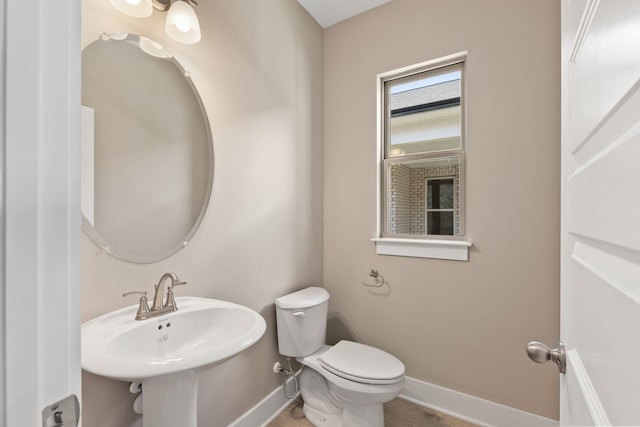 bathroom featuring sink and toilet