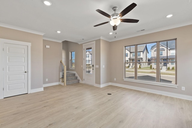 unfurnished living room featuring ornamental molding, ceiling fan, and light hardwood / wood-style floors