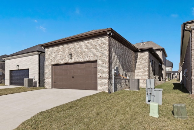 view of side of property featuring central AC, a yard, and a garage