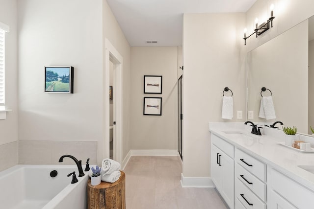 bathroom with tile patterned floors, vanity, and independent shower and bath