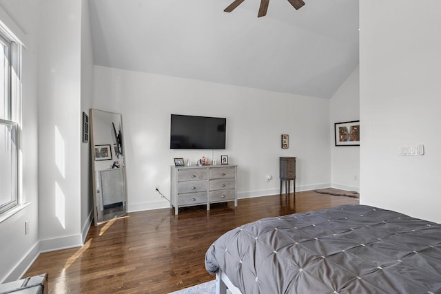 bedroom with lofted ceiling, dark hardwood / wood-style floors, and ceiling fan