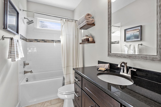 full bathroom with vanity, shower / tub combo, and toilet