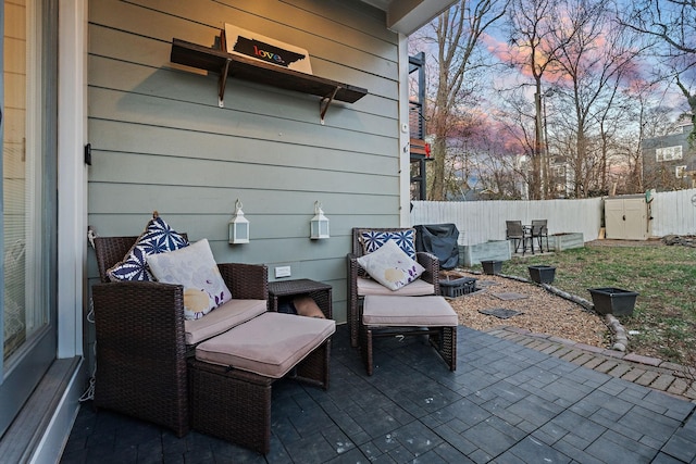 view of patio terrace at dusk