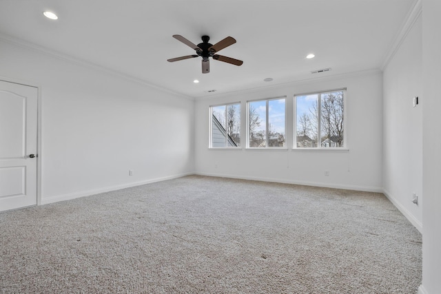 carpeted spare room featuring crown molding and ceiling fan