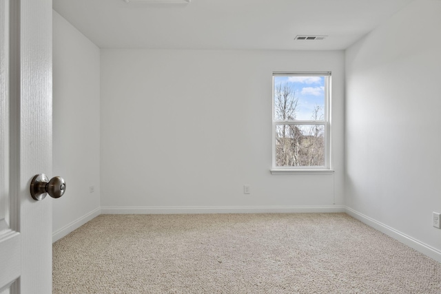 empty room featuring carpet flooring