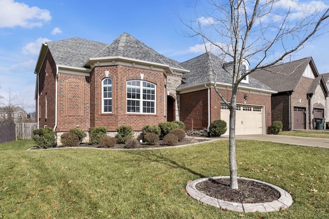 view of front of house with a garage and a front lawn