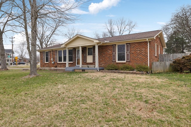 ranch-style home featuring a front yard and a porch