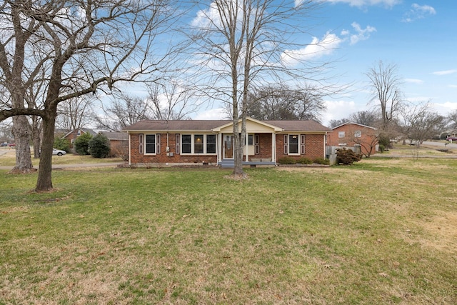 ranch-style home featuring a front yard