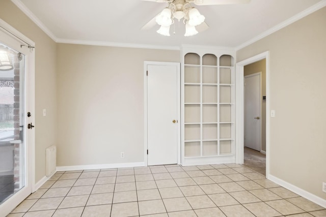 tiled spare room with crown molding and ceiling fan