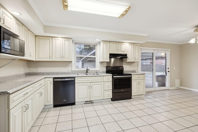 kitchen featuring crown molding, sink, light tile patterned flooring, and black appliances