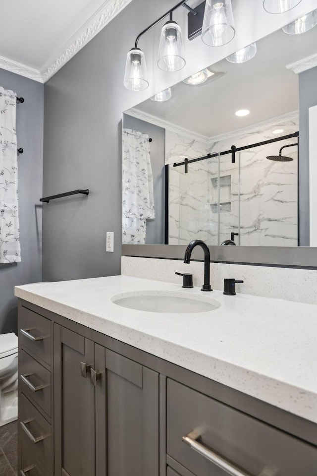 bathroom with crown molding, toilet, vanity, and walk in shower