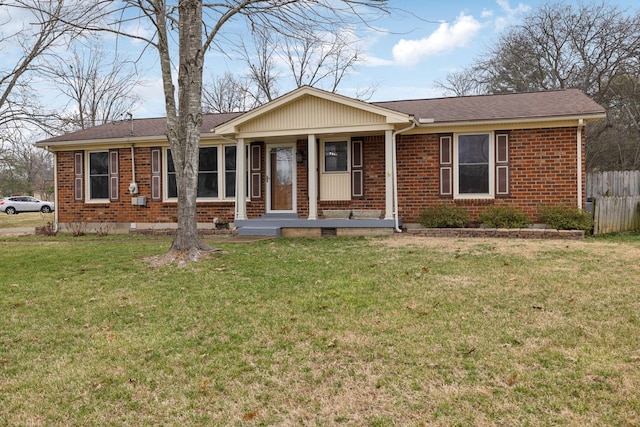 ranch-style home featuring a front yard and covered porch