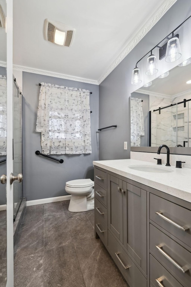 bathroom featuring a shower with door, crown molding, vanity, and toilet