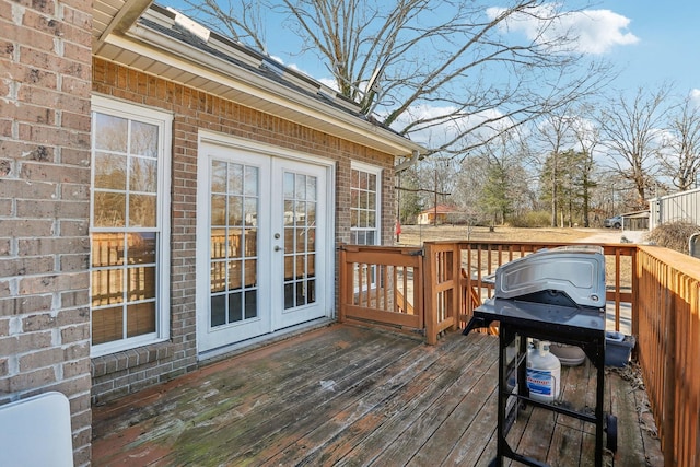 wooden deck with grilling area and french doors