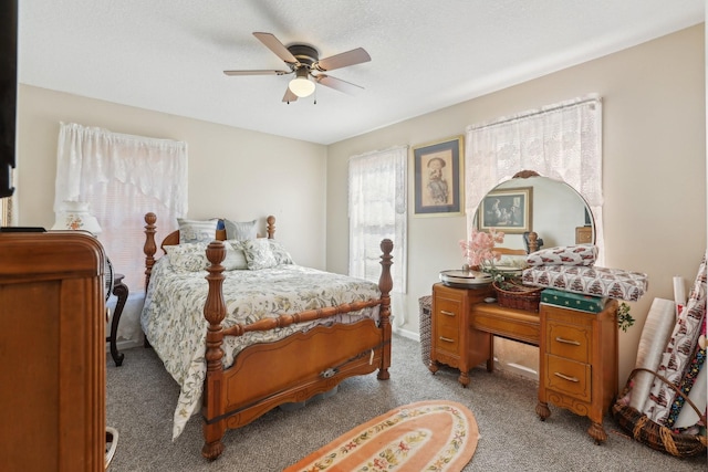 bedroom with light carpet, a textured ceiling, and ceiling fan