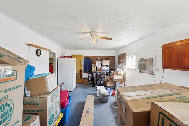 kitchen with ceiling fan, a wall mounted AC, and white fridge