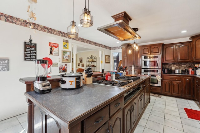 kitchen featuring pendant lighting, light tile patterned floors, backsplash, stainless steel appliances, and dark brown cabinetry