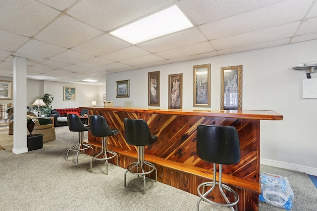 bar with carpet and a drop ceiling