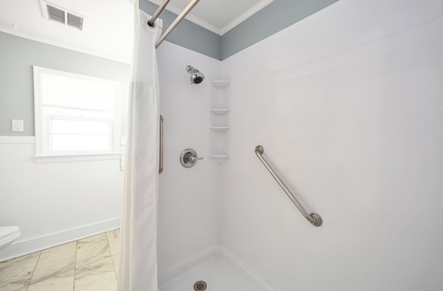 full bath featuring a stall shower, visible vents, toilet, ornamental molding, and marble finish floor