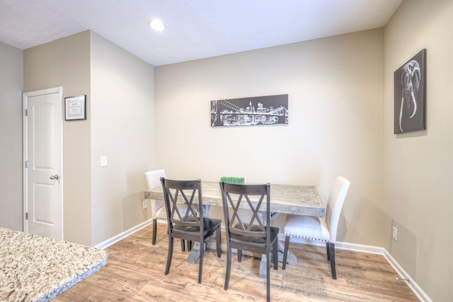 dining room with hardwood / wood-style flooring