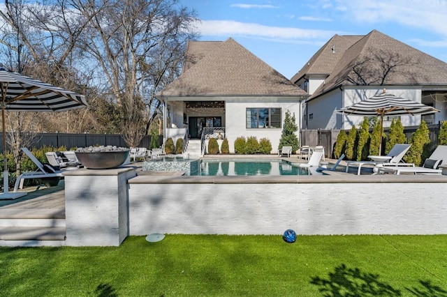 view of swimming pool with a lawn and a patio area