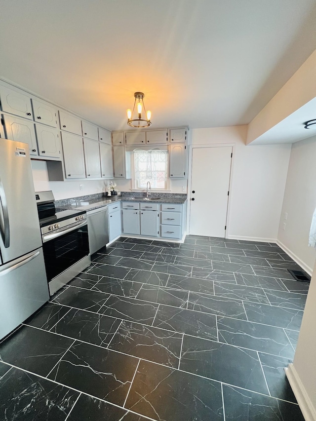 kitchen featuring appliances with stainless steel finishes, sink, and white cabinets