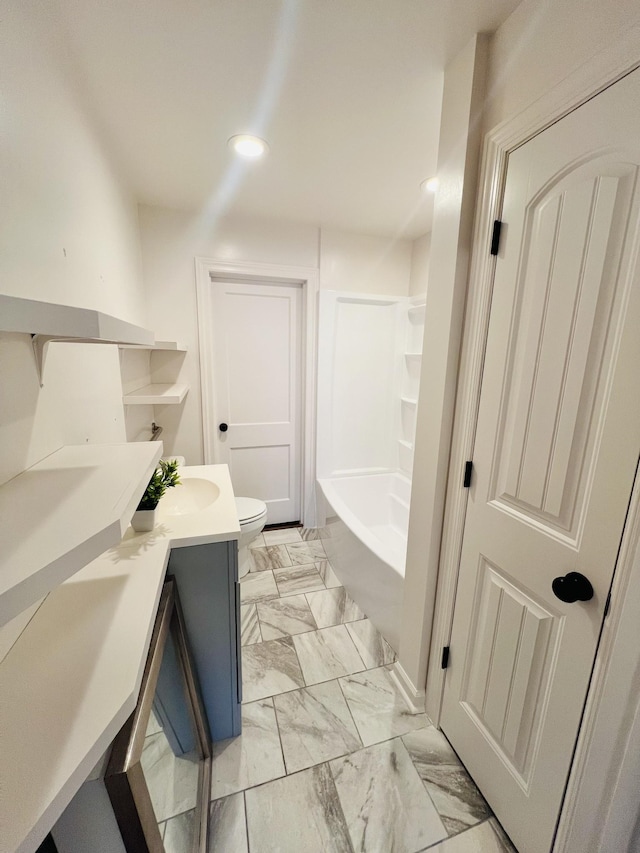 bathroom featuring vanity and toilet