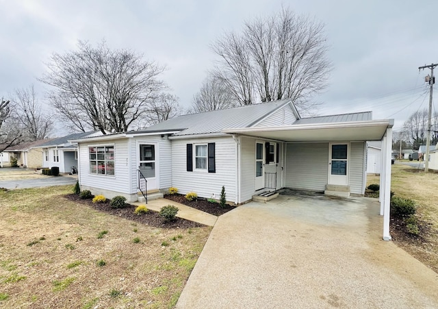 ranch-style house with a carport and a front yard