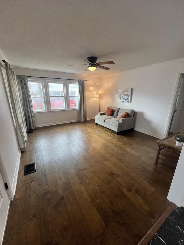 unfurnished bedroom featuring ceiling fan and dark hardwood / wood-style flooring