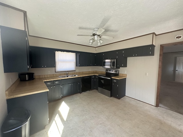 kitchen featuring appliances with stainless steel finishes, sink, ornamental molding, ceiling fan, and a textured ceiling