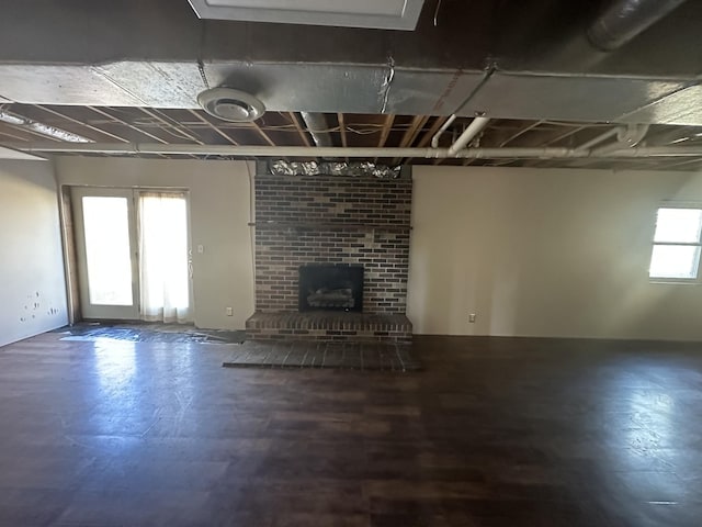 basement featuring a brick fireplace