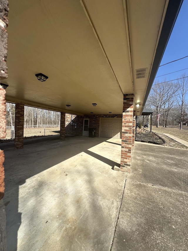 view of patio / terrace featuring a garage