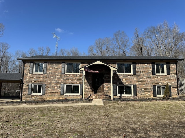 bi-level home with a front lawn