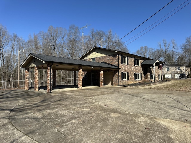 view of side of property with a carport