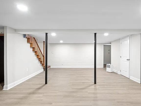 basement featuring light hardwood / wood-style floors