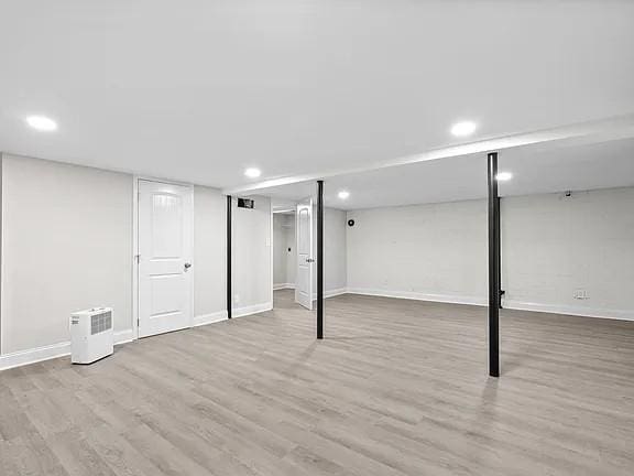 basement featuring light hardwood / wood-style flooring