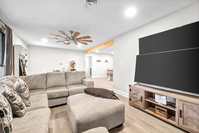 living room featuring ceiling fan and light hardwood / wood-style flooring