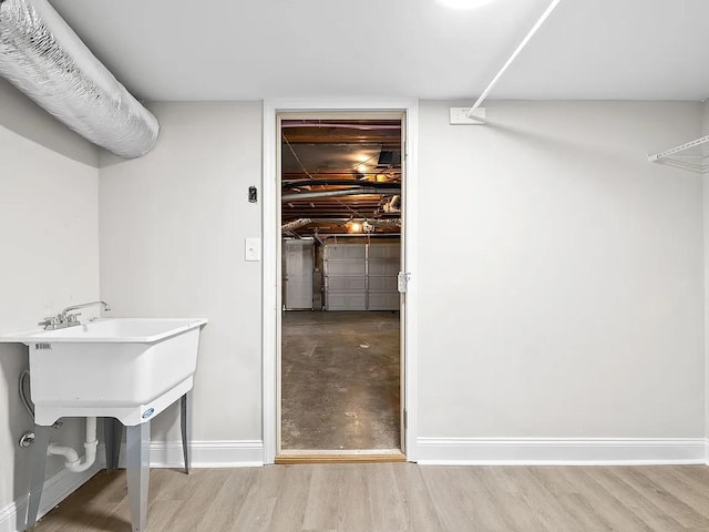 bathroom with hardwood / wood-style floors