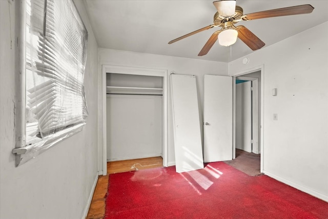 bedroom featuring multiple windows, a closet, and ceiling fan