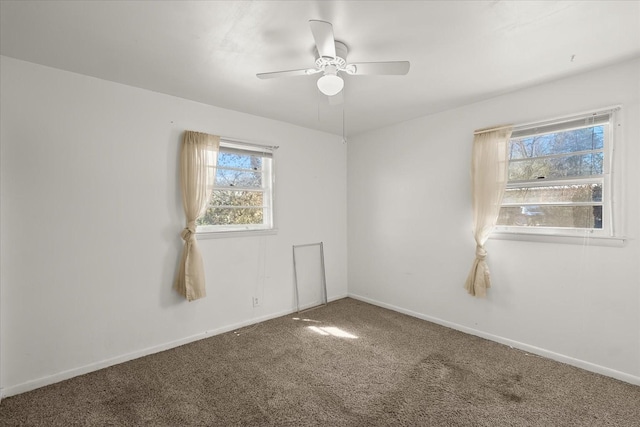 carpeted empty room featuring ceiling fan