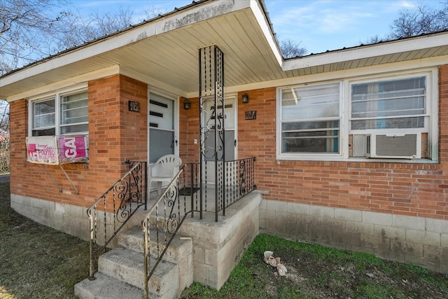 doorway to property featuring cooling unit