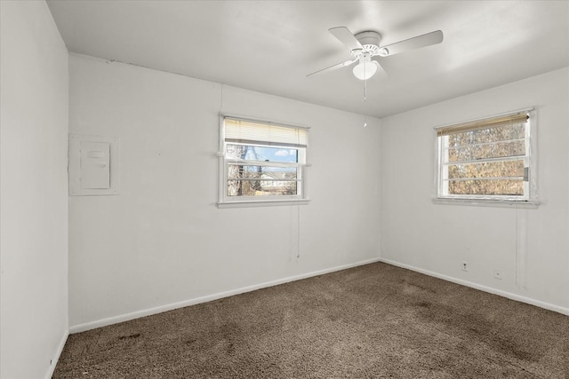 carpeted empty room featuring ceiling fan