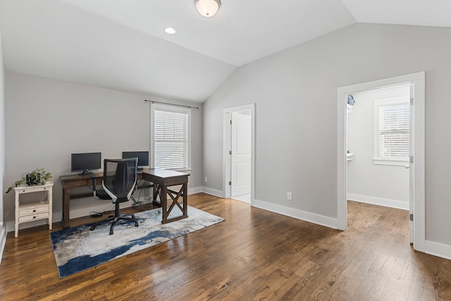 home office with lofted ceiling and dark wood-type flooring