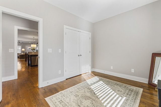 bedroom with a closet and dark hardwood / wood-style floors