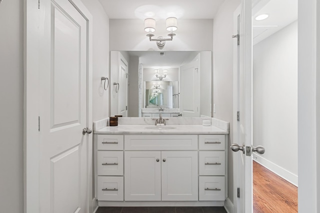 bathroom featuring vanity and wood-type flooring