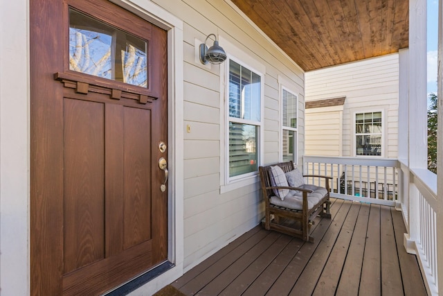 doorway to property featuring covered porch