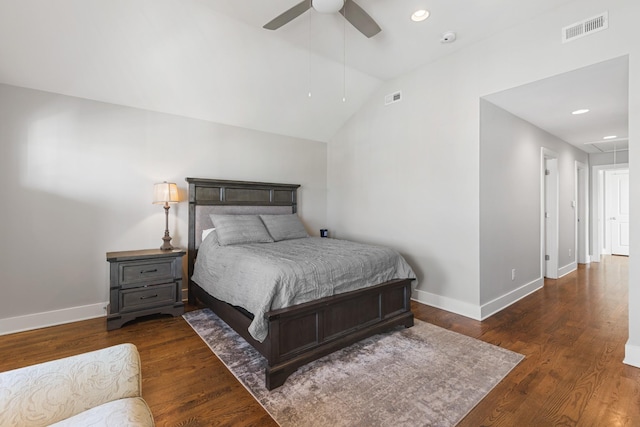 bedroom with ceiling fan, lofted ceiling, and dark hardwood / wood-style flooring