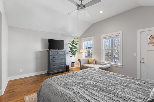 bedroom with lofted ceiling, dark hardwood / wood-style floors, and ceiling fan