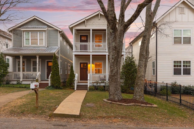 view of front of home featuring a yard and a porch