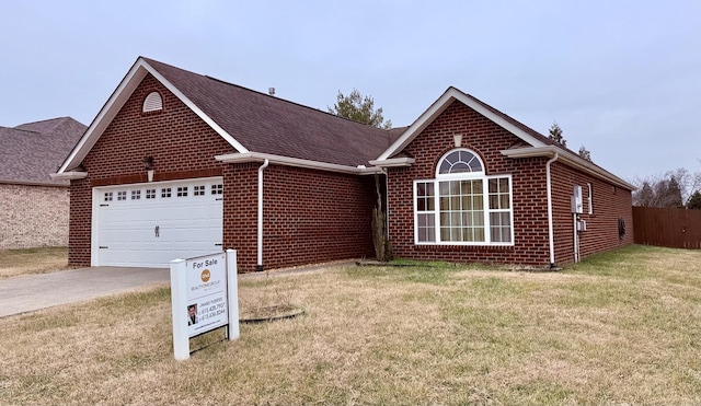 single story home with a garage and a front yard